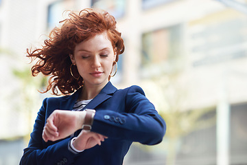 Image showing Business woman, watch and checking time for schedule, planning or appointment in the city. Female employee looking at wristwatch in travel, commute or work opportunity in the street of a urban town