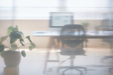 Image showing Glass, business and empty room in an office for work with a desk and computer for working. Interior design, architecture and executive workspace at a corporate company for a job in project management