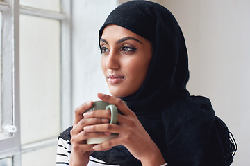 Image showing Window, thinking and Islamic woman with coffee, peace and calm in home, daydreaming and thoughts. Muslim female, hijab and lady with tea, staring outside and ideas for fantasy, future and wondering