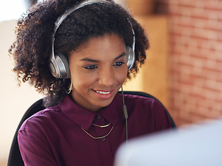 Image showing Music headphones, computer and black woman in office, working and streaming audio. Technology, business desktop and happy female employee listening to podcast, radio sound or album song in workplace.