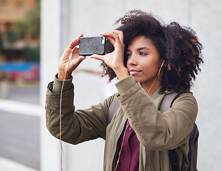 Image showing Music earphones, selfie and black woman in city taking pictures for travel memory outdoors. Profile picture, street and female student taking photo for social media post while streaming radio podcast