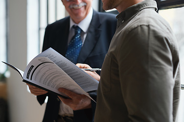 Image showing Closeup, senior man and employee with documents, discussion and sign contract for new job, project and schedule. Zoom, male employee and manager with paperwork, management and planning in workplace