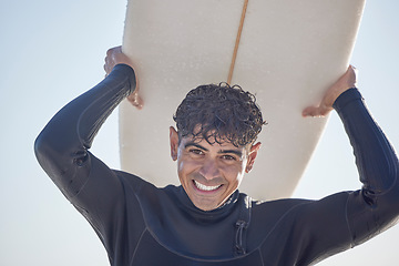 Image showing Portrait, surf and man surfer with surfboard at the beach, sea or ocean with a smile and is happy on a summer day. Exercise, surfing and male with swimsuit in Australia with freedom on the waves