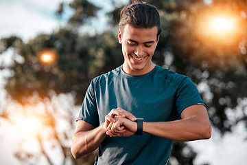 Image showing Smart watch, man and fitness at park for exercise workout, training and happy goals. Stopwatch, sports person and runner check time, heart rate or monitor healthy body progress, data app and wellness