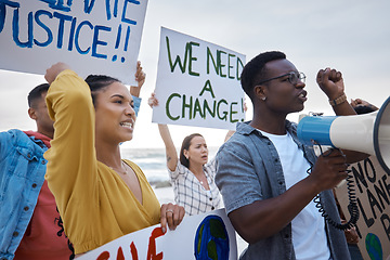 Image showing Angry, community and people at a protest for change, social justice and freedom together. Banner, power and group of protesters in a crowd for a revolution, speech and movement for equality fight