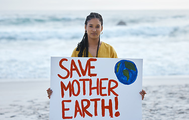 Image showing Save earth, sign and woman portrait at beach for pollution, environment and green planet protest. Ocean, sea and nature globe poster or cardboard for awareness, global warming and climate change