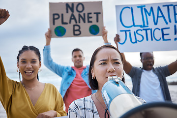 Image showing Megaphone, climate change protest and Asian woman with crowd at beach protesting for environment and global warming. Save the earth, group activism and people shouting on bullhorn to stop pollution.