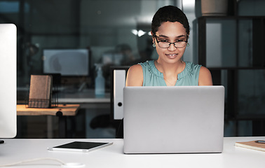 Image showing Laptop, night and business woman reading finance portfolio feedback, stock market database or cloud computing. Forex investment budget, data analysis and African trader trading NFT, bitcoin or crypto