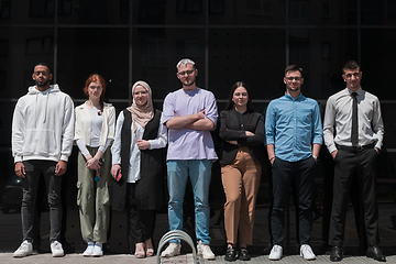 Image showing A diverse and confident group of young businessmen poses together, radiating success, ambition, and unity, capturing the essence of a dynamic and inspiring business environment