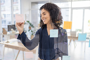 Image showing Planning, thinking and writing by black woman in office for agenda, calendar or schedule on sticky note. Creative, strategy and lady in idea for future, vision and innovation, mission and career goal