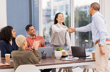 Image showing B2b, Asian manager or man shaking hands in meeting or startup project partnership or business deal. Applause, handshake or happy worker talking or speaking of our vision, feedback or hiring agreement