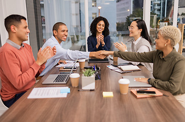 Image showing Winner, black woman or man shaking hands in meeting or startup project partnership or business deal. Success, handshake or happy worker with sales goals, bonus target or hiring agreement in office