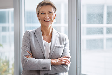 Image showing Business woman, portrait or arms crossed by window in corporate financial, investment company or insurance office. Smile, happy or confident mature ceo in about us with success mindset for management