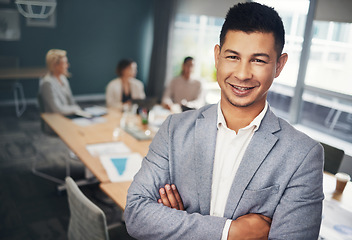 Image showing Leadership, confidence and portrait of businessman in the office in a meeting with colleagues. Corporate, management and professional male manager standing with crossed arms in boardroom in workplace