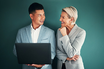 Image showing Laptop, collaboration and planning with a business team in studio on a green background for strategy. Computer, teamwork or management with a man and woman working on growth as company leadership