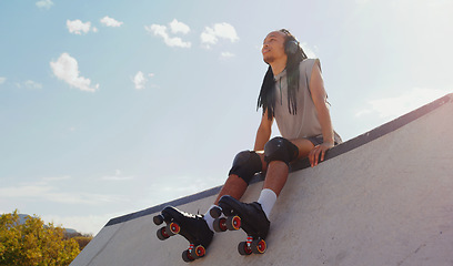 Image showing Music, relax and man rollerskating at a park, thinking and sitting in peace in Australia. Freedom, idea and person planning to skate on a ramp with audio from headphones for motivation in nature