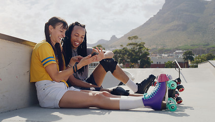 Image showing Friends, phone and women relax after roller skate training in a skate park browsing social media trend on the internet. Online, connected and extreme sports people resting and laughing at meme