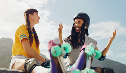 Image showing Rollerskate, skatepark and sports with a couple of friends sitting outdoor on a ramp for recreation together. Fitness, diversity or fun with a man and woman bonding outside for an active hobby