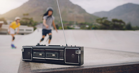 Image showing Skate park, music and a retro radio outdoor for urban skating with people in blurred background. Freedom, cassette tape and energy for balance sports, action and training for fitness with audio sound