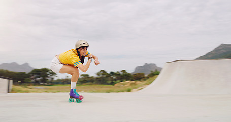 Image showing Roller skate, extreme sports and woman riding fast with speed in a skate park with mockup space outdoors. Rollerskate, skater and female skating practicing or training with safety helmet