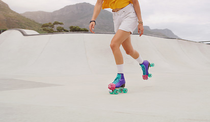 Image showing Fitness, health and roller skates with shoes of woman in park for training, hobby and freedom. Summer break, sports and speed with feet of girl skating for exercise, workout and movement in outdoors