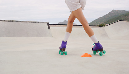 Image showing Fitness, skating and roller skates with shoes of woman in skate park for training, hobby and freedom. Summer, sports and speed with girl skater and challenge course with cones for exercise or workout