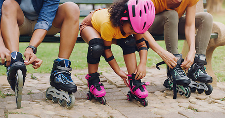 Image showing Family, children or rollerblade with a girl and parents in the park together for fun or recreation. Kids, love or learning with a mother, father and daughter bonding outdoor while rollerblading