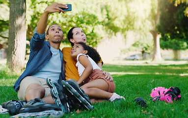Image showing Interracial parents selfie, girl and park with funny face, rollerskate and family profile picture, happy or holiday. Black man, mother and kid for relax, hug and diversity for social network photo