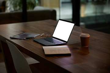 Image showing Night, work and mockup laptop on a table for business, late shift and organized workspace. Planning, corporate and blank computer screen for marketing on a desk for a deadline or overtime in the dark