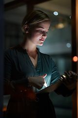 Image showing Dark, tablet and woman is working overtime in late in the evening in a modern office for a startup company. Person, internet and female entrepreneur typing online in a blackout due to power cut