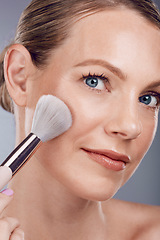 Image showing Face, makeup brush and woman in portrait, beauty and skin glow with lashes and foundation on studio background. Powder, cosmetics tools and skincare with shine, cosmetology and cosmetic care zoom