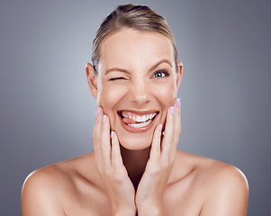 Image showing Skincare, comic and portrait of a crazy woman isolated on a grey studio background. Funny, makeup and a model for cosmetics, beauty expression and showing humor on a backdrop with tongue out