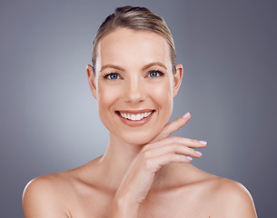 Image showing Skincare, woman and smile portrait in studio for beauty, dermatology or wellness cosmetics on background. Happy female model, face and aesthetic glow of shine, facial transformation and makeup