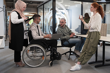 Image showing Young group of business people brainstorming together in a startup space, discussing business projects, investments, and solving challenges.