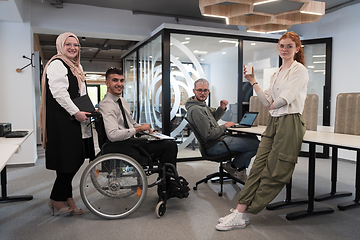 Image showing Young group of business people brainstorming together in a startup space, discussing business projects, investments, and solving challenges.