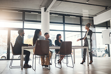 Image showing Business woman, coaching and meeting in conference for idea or leadership at office workshop. Female leader, coach or mentor speaking in staff training for marketing, planning or corporate strategy