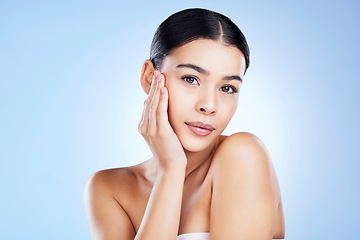 Image showing Portrait, face and aesthetic with a model black woman in studio on a blue background for skincare. Relax, beauty and spa with an attractive young female posing to promote natural skin treatment