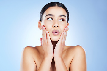 Image showing Woman, beauty and skincare with pout, lips botox and aesthetic cosmetics on blue background. Female model, lip filler and kissing face for plastic surgery, facial treatment and dermatology in studio