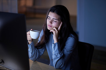 Image showing Night, coffee and exhausted with woman in office for deadline, burnout and overtime goals. Stress, headache and mental health problems with employee at computer for research, overworked or frustrated