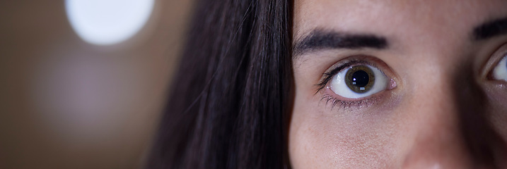 Image showing Eye, half and portrait of face of woman with a stare, serious and looking intense isolated in blurred background. Angry, mad and mysterious person or female at night, evening or late with mockup