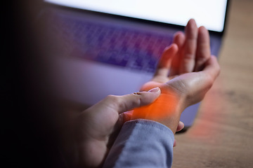 Image showing Wrist injury, office and hands with pain after accident while typing on laptop in workplace. Carpal tunnel syndrome, strain and business woman with fibromyalgia, arthritis or inflammation in company.