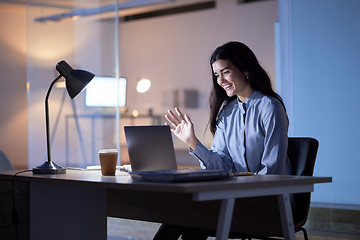 Image showing Laptop, wave and business woman on video call talking, chatting or speaking in office workplace at night. Computer, hello and happy female employee waving in online meeting, virtual chat or webinar.