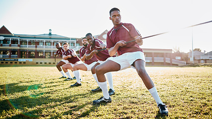 Image showing Sports, teamwork and tug of war, men at fitness training and practice for competition or game on field. Workout, collaboration and team pulling rope, working together in match for power and strength