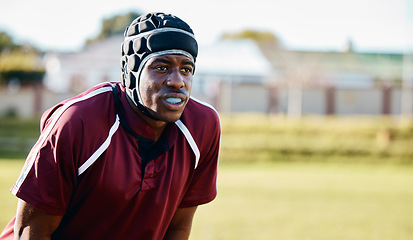 Image showing Sports, rugby and black man athlete on field playing or training for a game or competition. Fitness, outdoor and African male football player doing exercise or workout on grass by a stadium or arena.