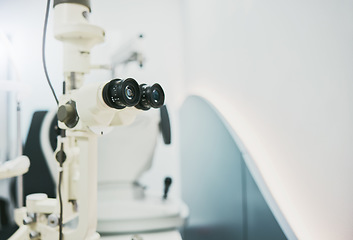 Image showing Ophthalmology machine, eye care and interior for medical healthcare, wellness or vision in clinic office. Optometrist consultation room, help or technology for digital equipment by blurred background