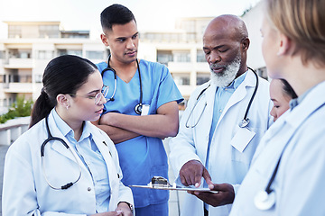 Image showing Doctor, team and planning with clipboard in the city for healthcare schedule, appointments or collaboration. Group of doctors, medical student or internship in teamwork discussion, medicine or tasks