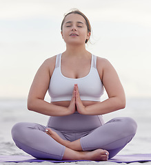 Image showing Yoga meditation peace, beach and woman meditate for spiritual mental health, chakra energy balance or soul aura healing. Nature zen, freedom or pilates girl relax for mindfulness, mindset or wellness