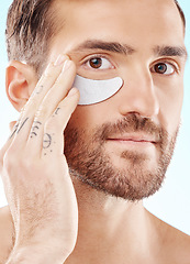 Image showing Eye, beauty mask and portrait of a man with dermatology cosmetics with collagen benefits for skin. Aesthetic model person with gel patch for skincare, self care and spa facial for health and wellness