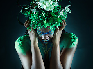 Image showing Frustrated, nature and mother earth model feeling sad from climate change in studio. Costume makeup, angry and black person with isolated and dark background upset about pollution and environment