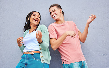 Image showing Dance, funny and interracial couple with air guitar on a wall for bonding, fun and playful in the city. Smile, laughing and black woman with a man playing an imaginary instrument for comedy together